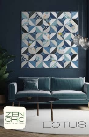 This cover shows a quilt in shades of light to dark blue and whites, with curved pieced blocks in a modern quilt block and design.