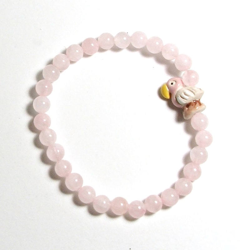 SB6-012-6mm STONE ROUND BEAD BRACELET IN BIRD DESIGN -7 1/2"