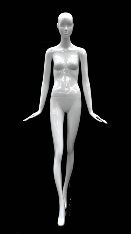 Abstract female mannequin in glossy white fiberglass with flared hands and a round glass base.