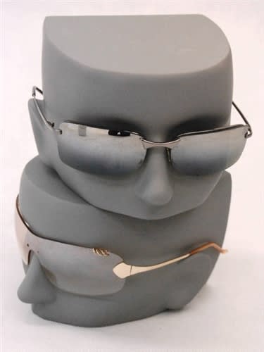 Set of four gunmetal gray female split face forms made of fiberglass for stackable retail sunglasses display.