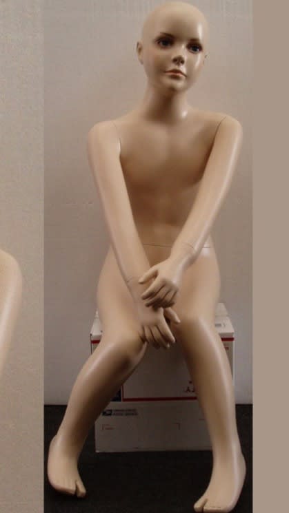 Realistic child mannequin made of fiberglass with detachable arms for retail clothing displays. Realistic child mannequin made of fiberglass with detachable arms for retail clothing displays.