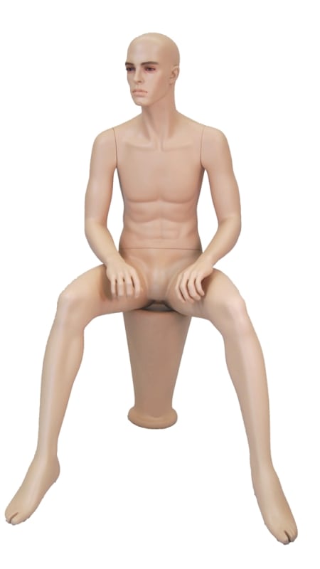 Realistic male mannequin seated with arms on knees for retail clothing and lifestyle display