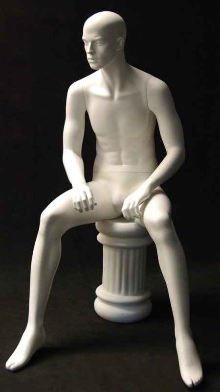 Matte white male mannequin seated with arms on knees for retail clothing and fashion display