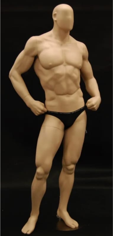 Ripped muscular male mannequin with hands on hips for fitness apparel and athletic retail display