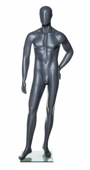 Grey fiberglass male mannequin with hand on hip standing on a square glass base with dual foot and calf supports.