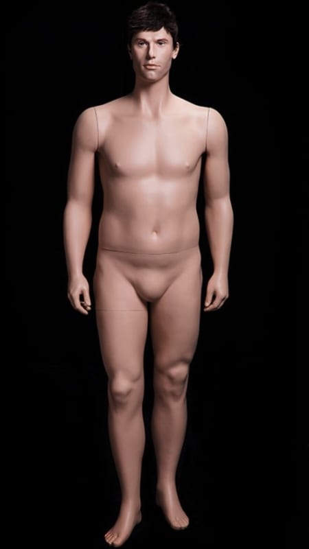 Realistic male fiberglass mannequin in flesh tone with a metal base for retail clothing display.