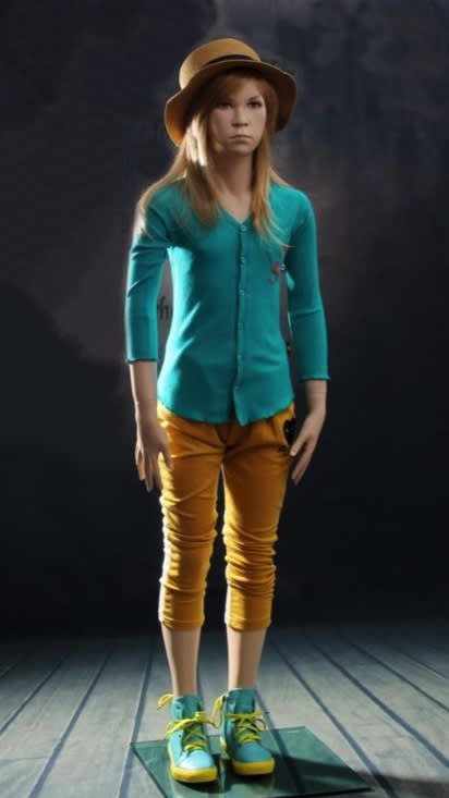 Preteen female fiberglass mannequin with metal base and calf support for tween clothing displays.