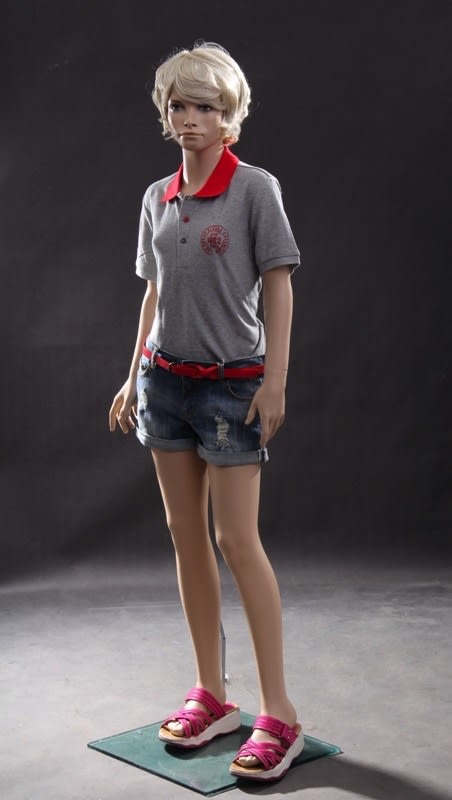 Preteen female fiberglass mannequin with metal base and dual calf and heel support for retail clothing displays.