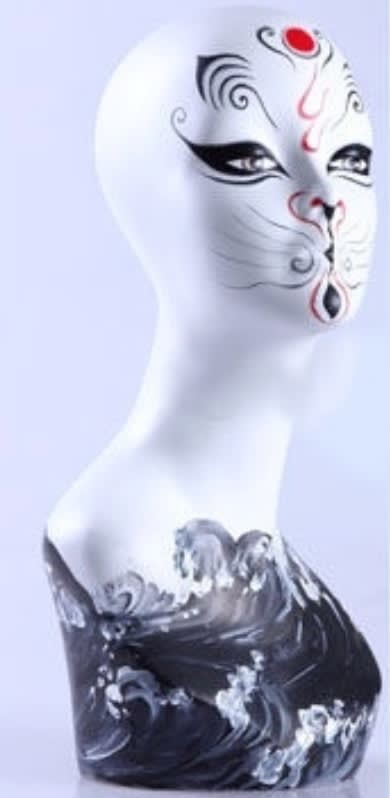 Artistic tribal cat makeup female display head made of fiberglass for retail accessory merchandising.