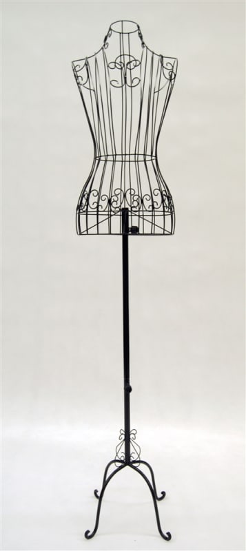 Black female metal wire dress form standing on an antique metal base for retail garment display.