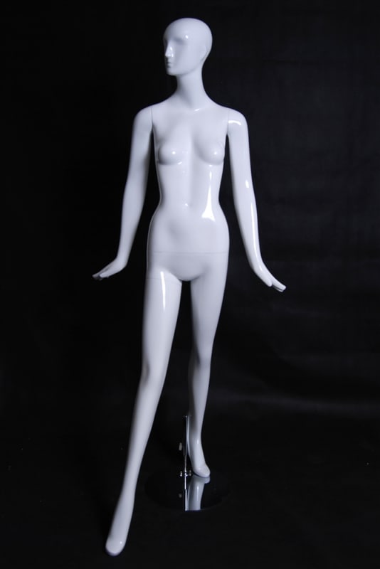 Elegant standing female abstract mannequin in a glossy white fiberglass finish with a silver metal base.