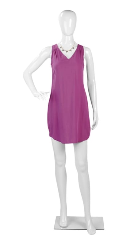 Glossy white plastic female egghead mannequin in a hand-on-hip pose with a clear glass base