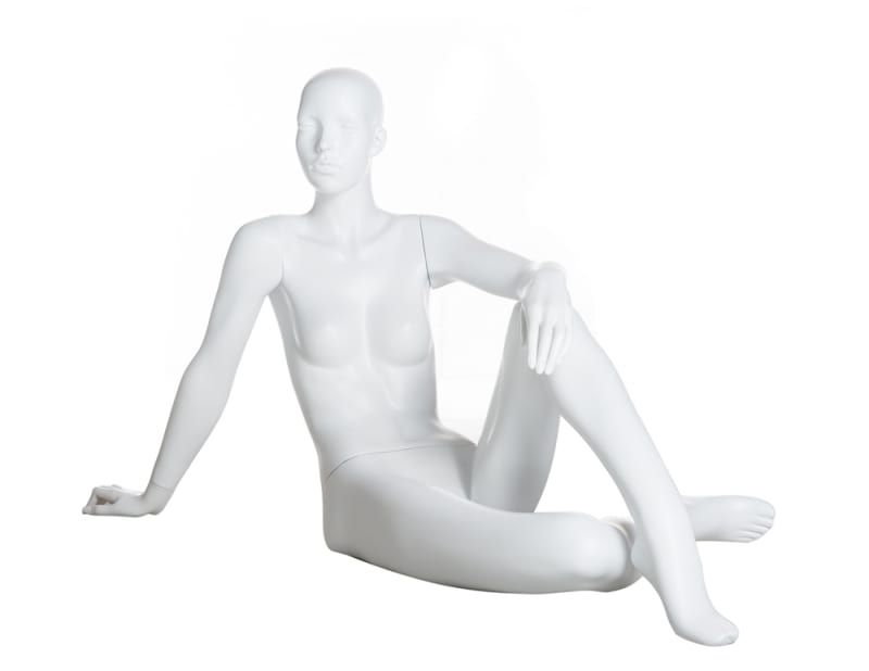 Matte white female realistic head fiberglass mannequin sitting with one hand on her knee for retail clothing displays