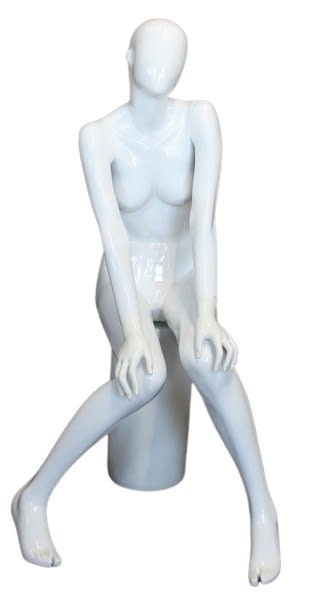 Gloss white fiberglass female egghead mannequin in an elegant seated pose with hands on knees, ready for retail apparel display.