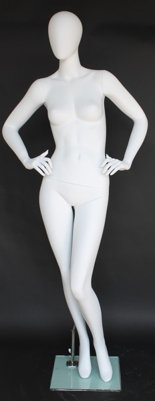 Matte white female egghead mannequin made of durable fiberglass with hands on hips pose, standing on a tempered glass base for retail clothing display.