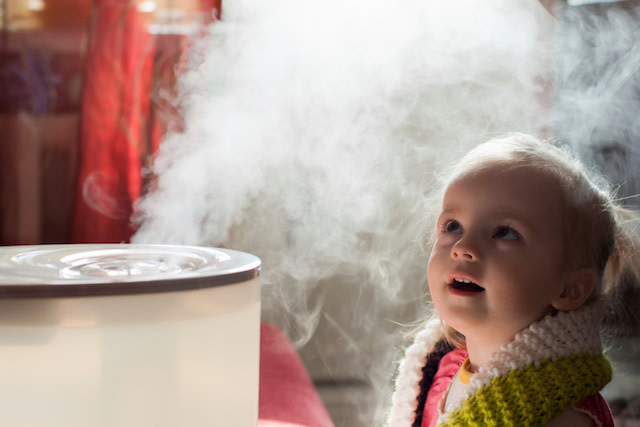 girl watching humidifier