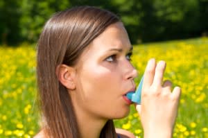 Girl with asthma inhaler