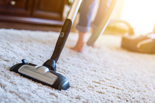vacuum carpeting and dust