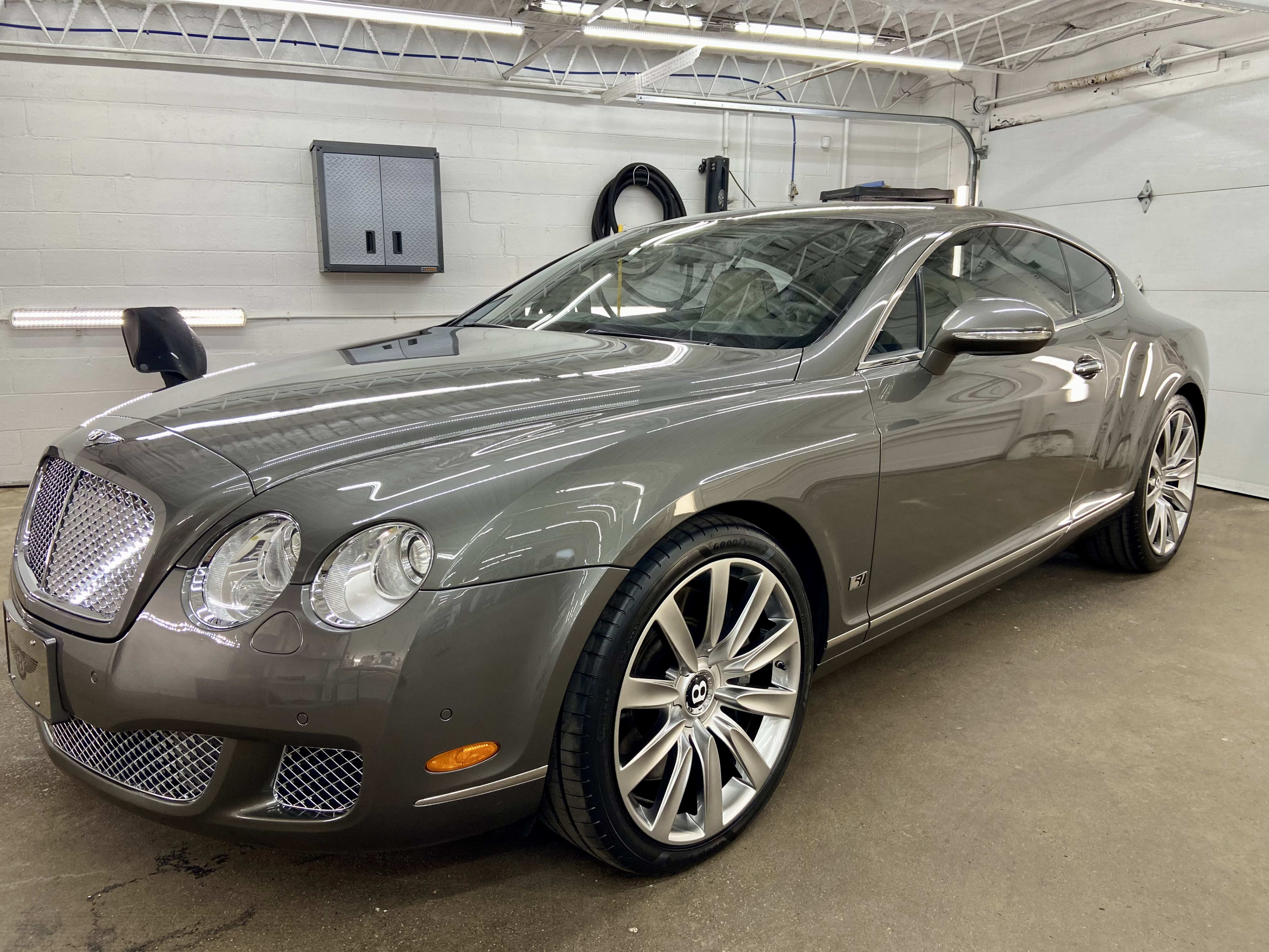 Bentley in JayClean garage after exterior detailing and finish prep