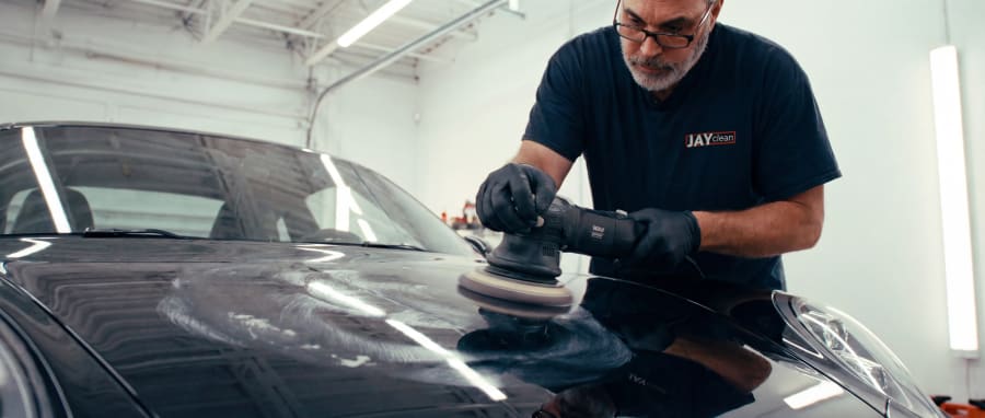 Paint correction finish with reduced swirls and restored clarity