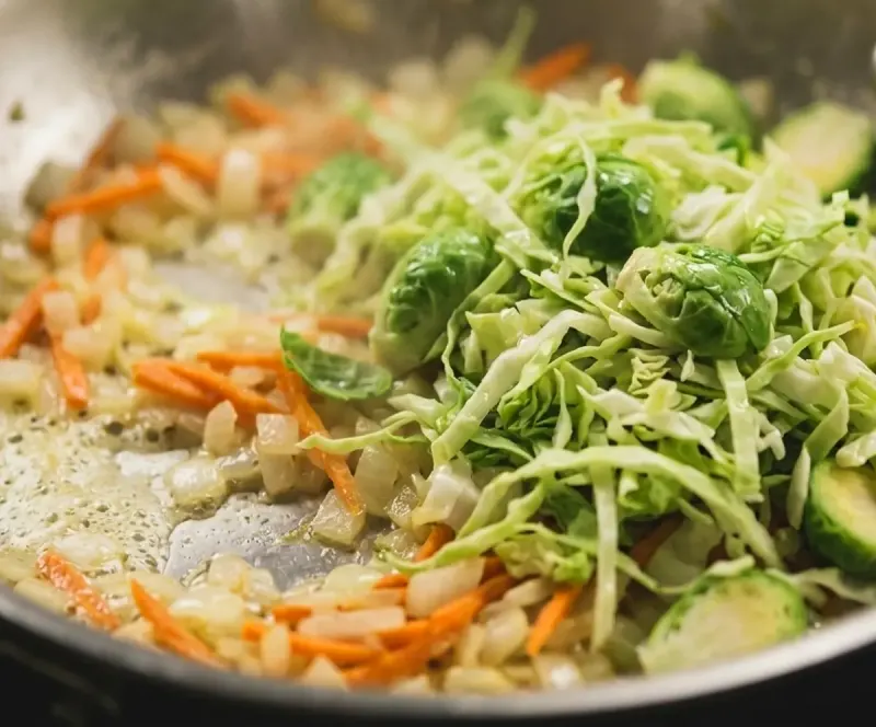Shred and soften the greens
