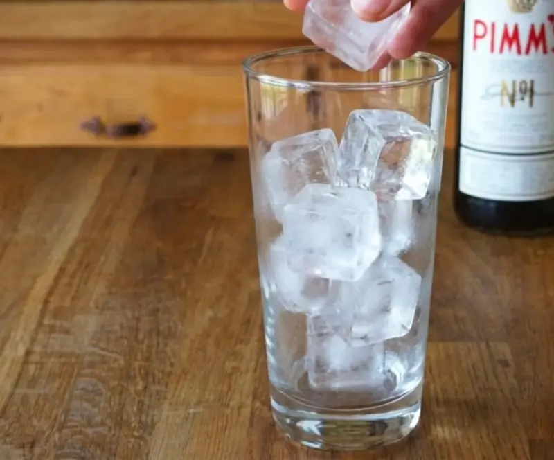 Load the glass with ice — generously