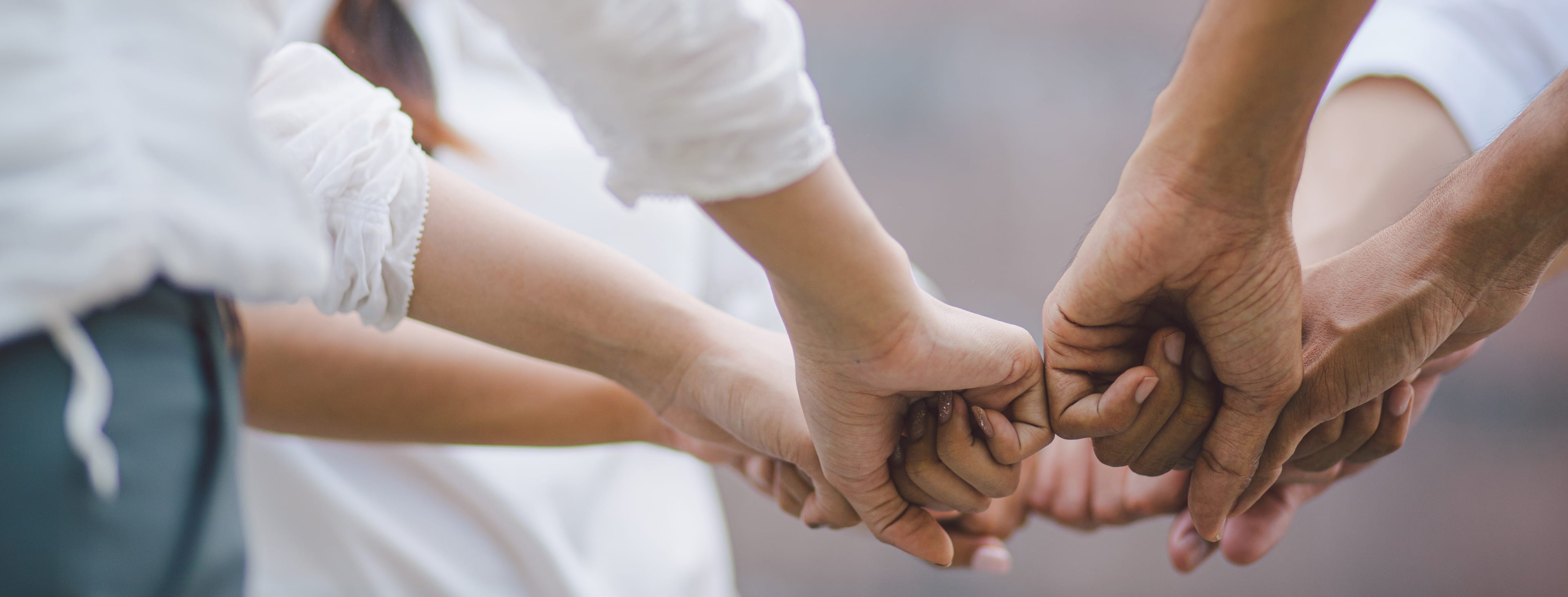 Business team standing hands together