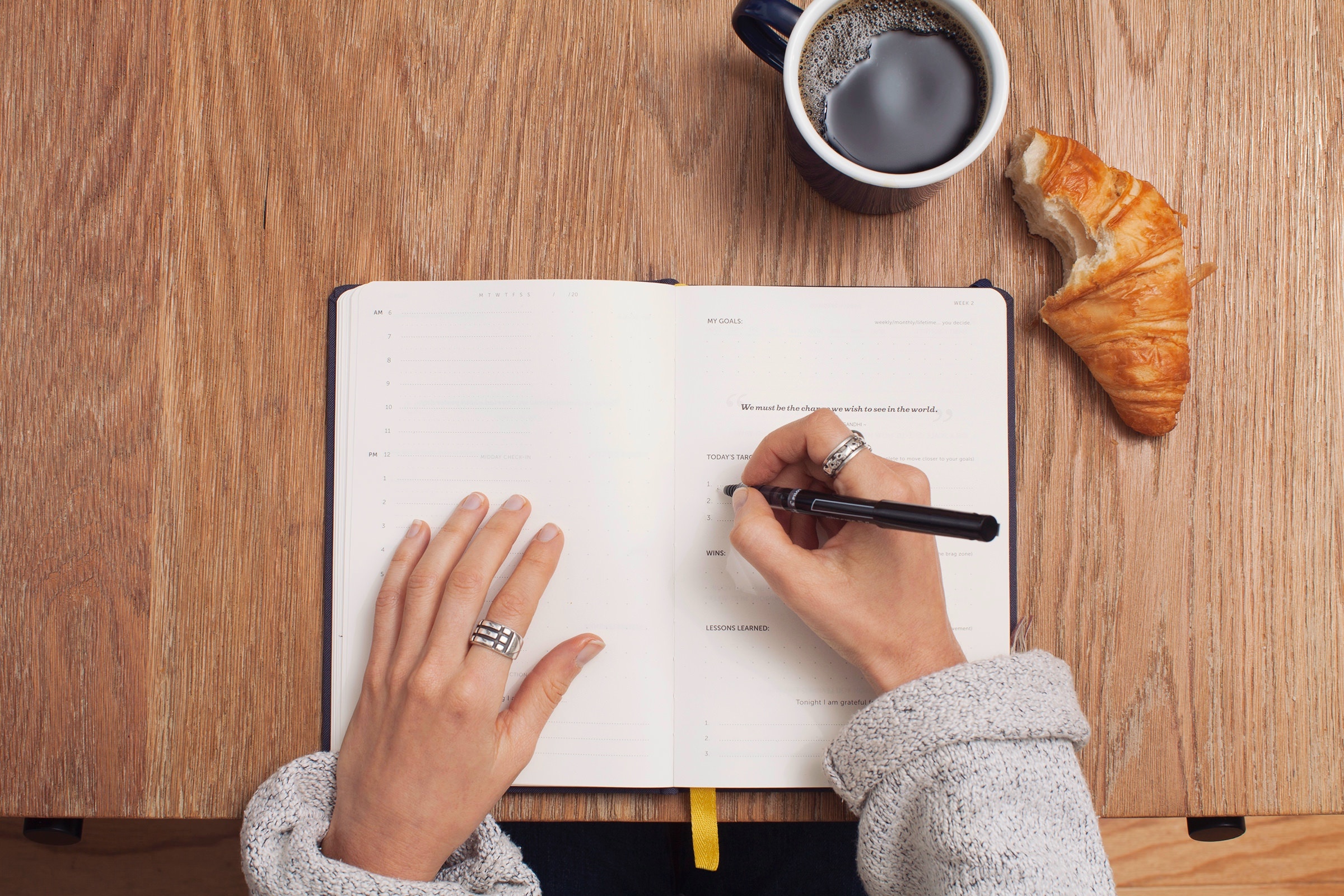 Hands writing in a journal {768x432}