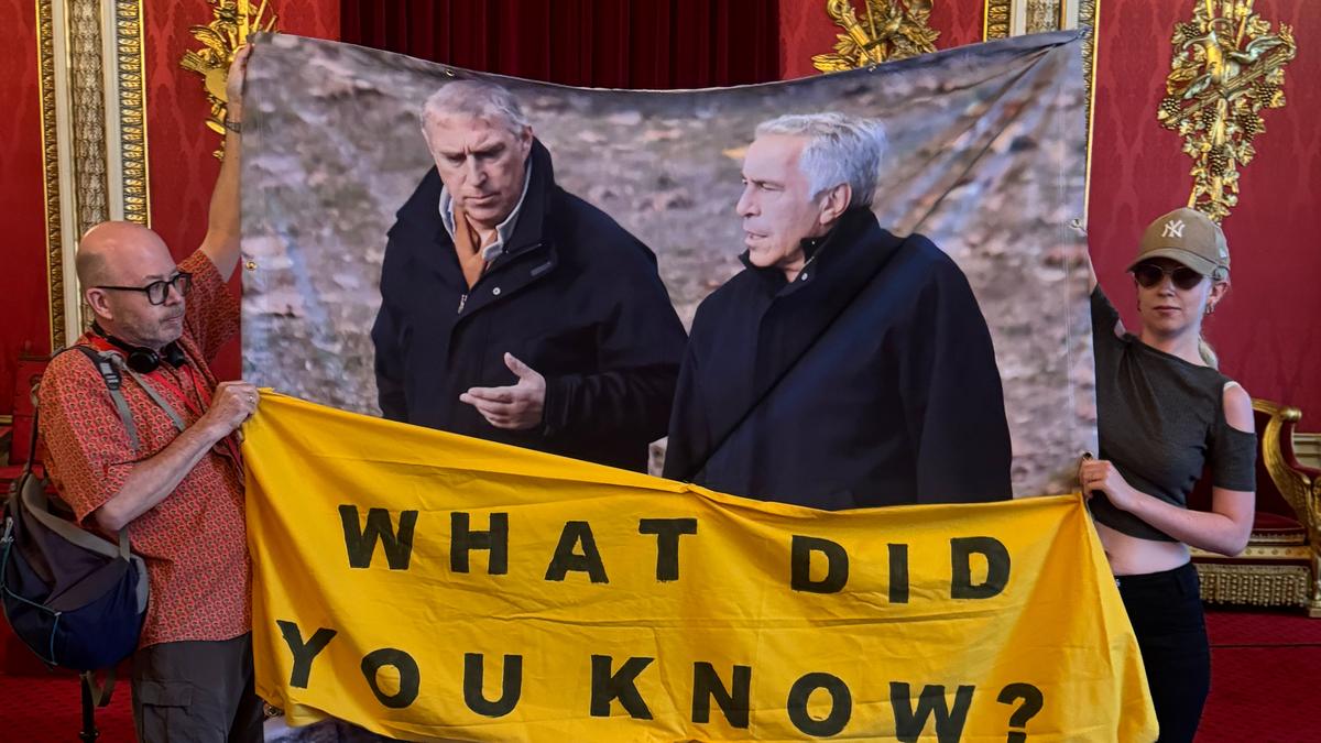activists unveil banner linking ex-prince andrew to jeffrey epstein at buckingham palace