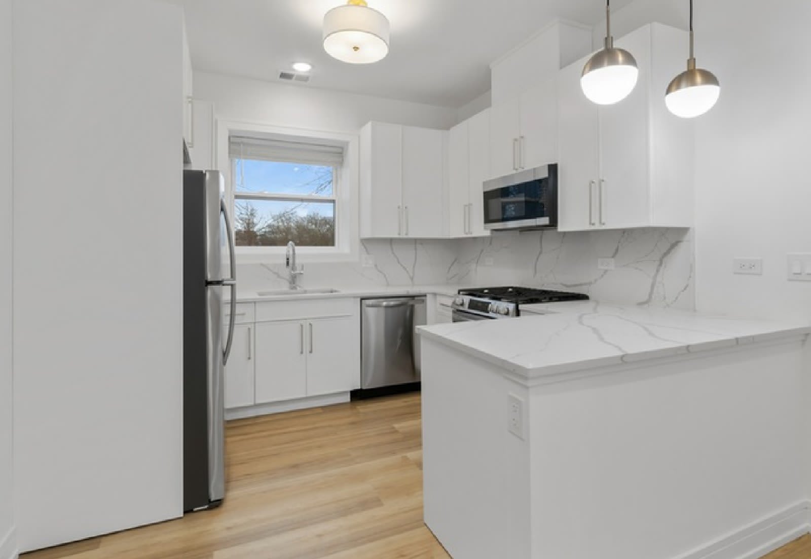 Renovated kitchen with peninsula
