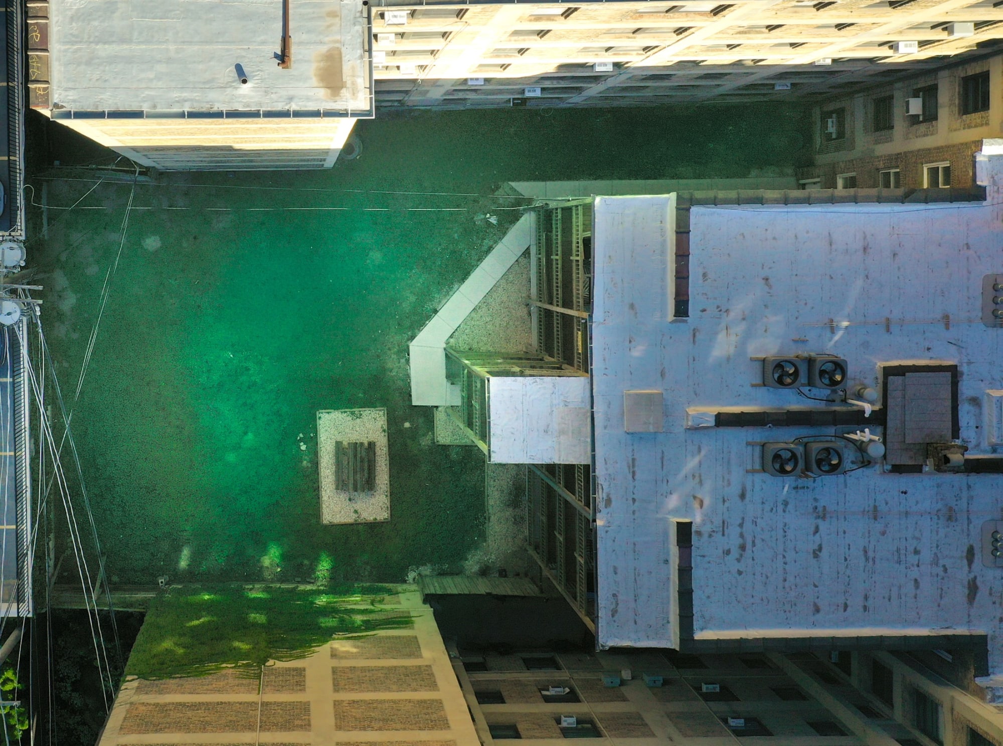 Top-down drone view of the roof and rear yard