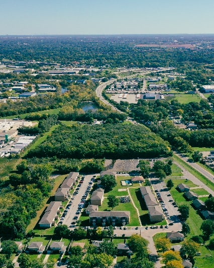 High aerial looking north over the property toward Aurora