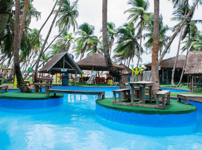 Pool and thatched huts at La Campagne Tropicana