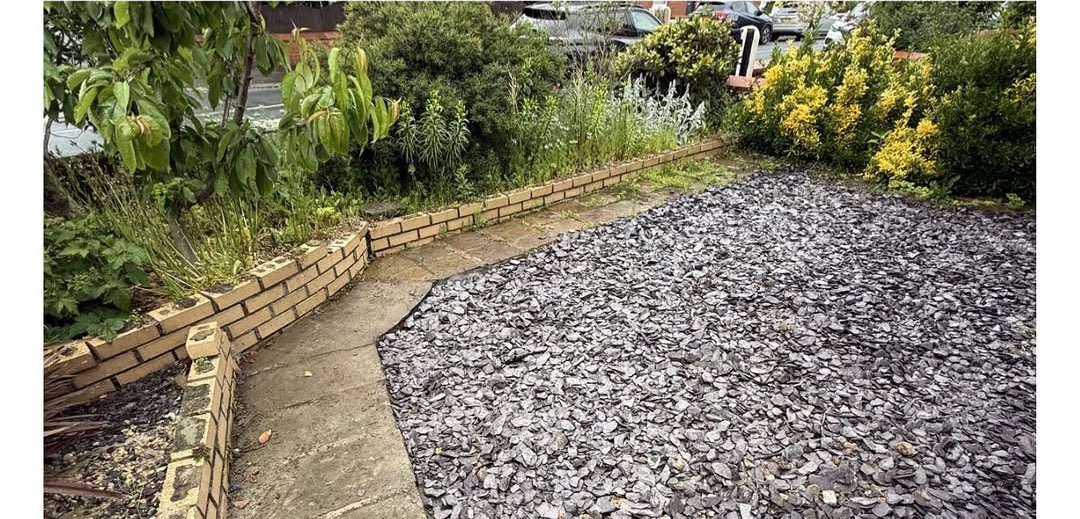 Garden after rubble cleared with clean gravel path