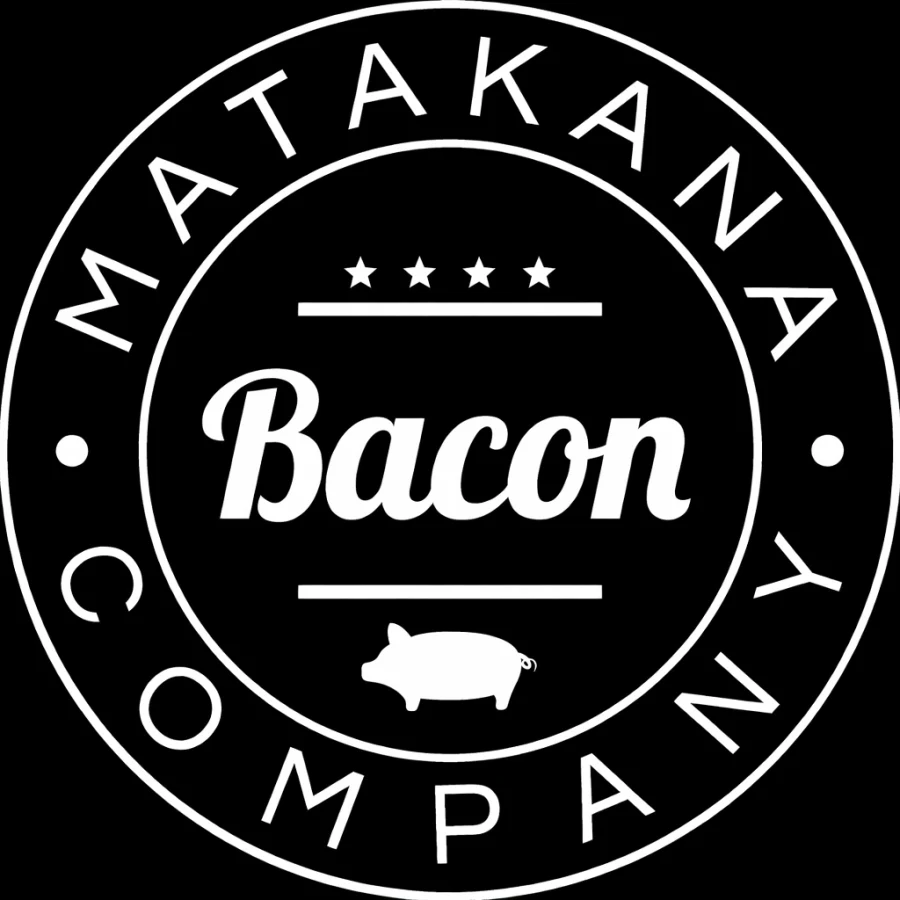 White circular logo for Matakana Bacon Company, featuring 'Bacon' in script, five stars, and a pig silhouette. Butcher from Matakana.