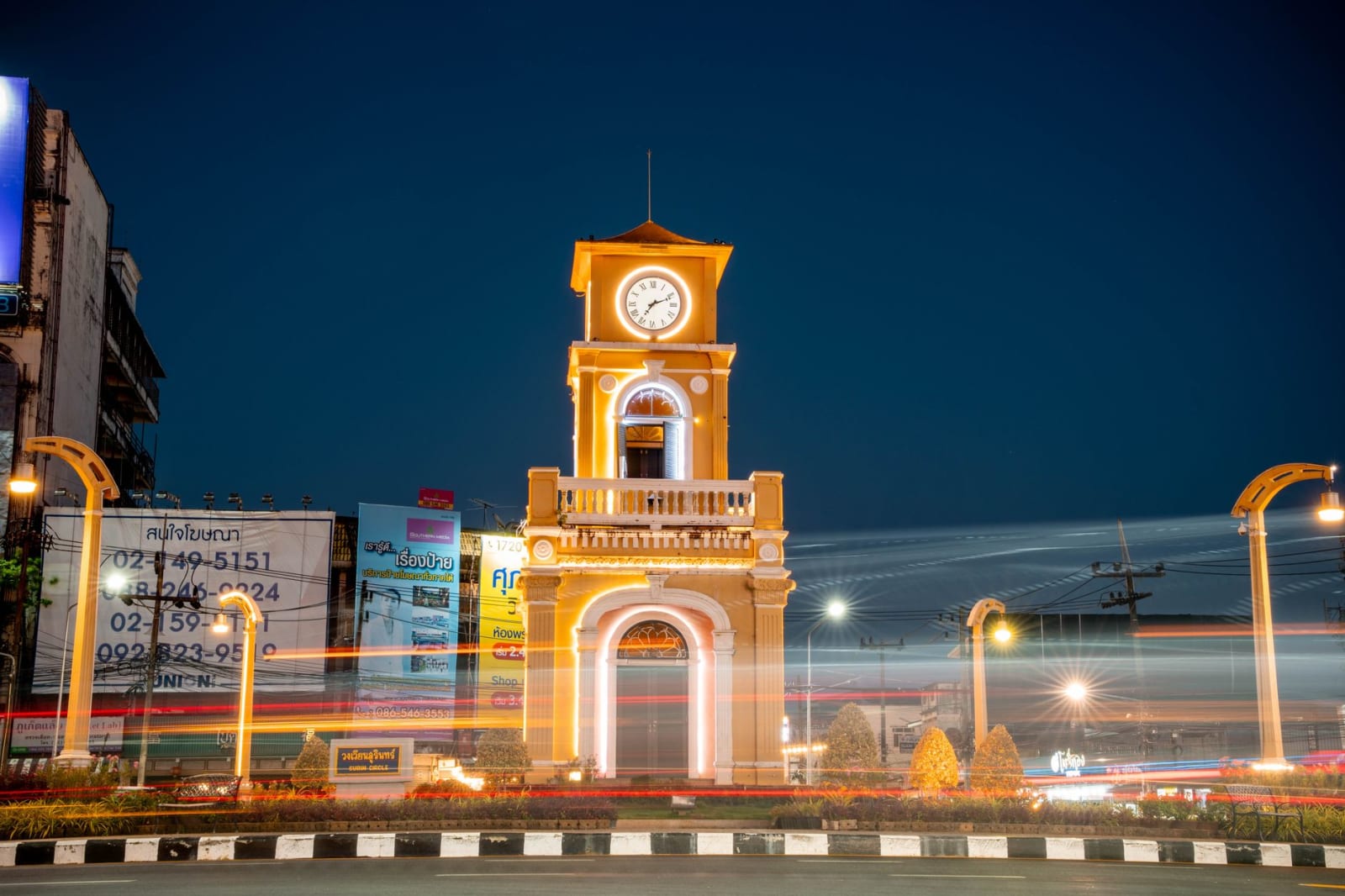 Traffic circling the clock tower in Phuket Town after dark