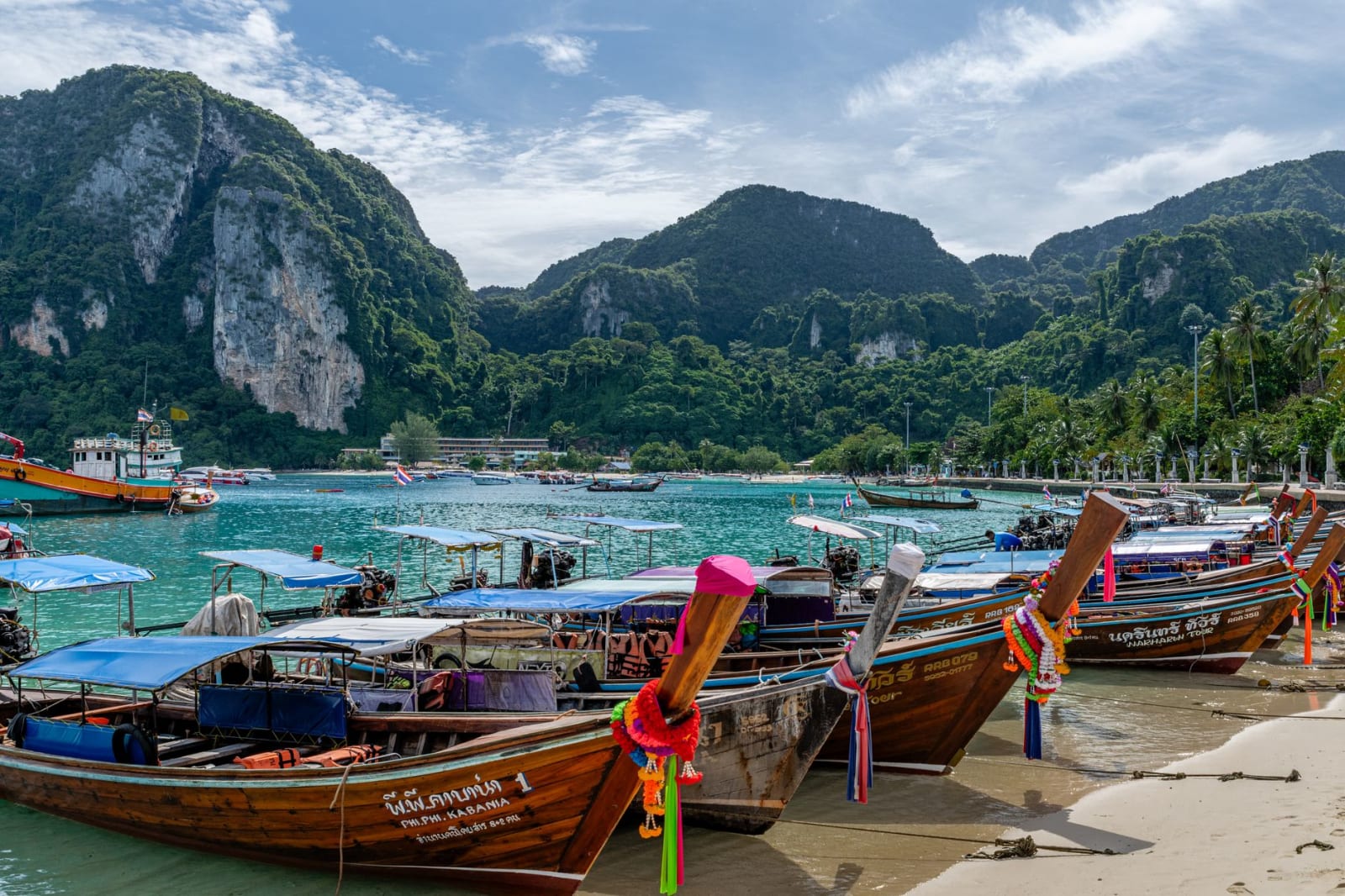 Longtail boats moored at a Phuket beach