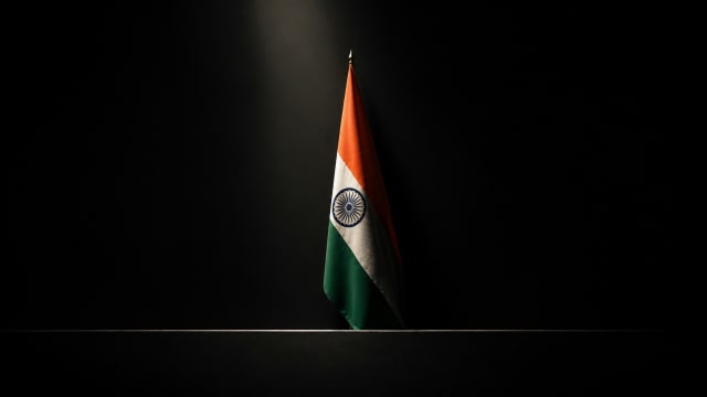 Minimalist Indian Independence Day flag against a dark background, symbolising India's 1947 independence, political freedom, sovereignty and the unfinished journey toward equality.