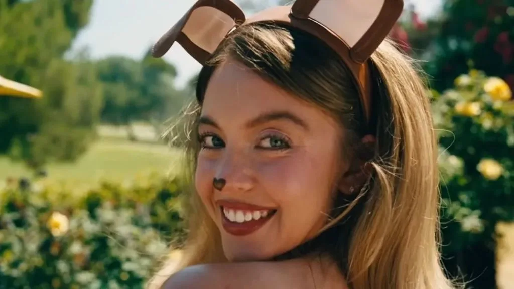 Still from HBO's TV show Euphoria showing Sydney Sweeney wearing Bunny Ears with a backdrop of a garden behind her