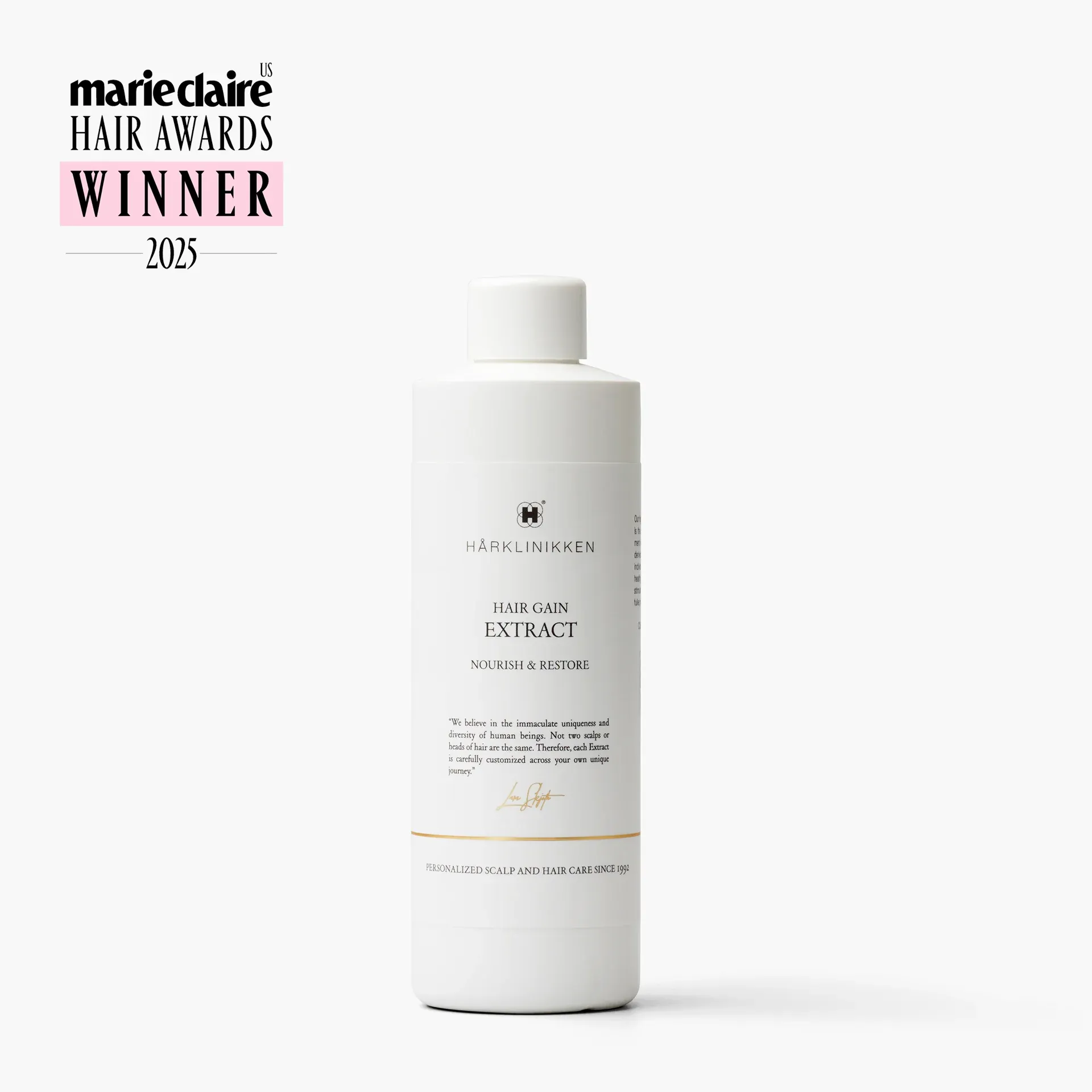 A white bottle of Hårklinikken Hair Gain Extract on a white background, with a Marie Claire US Hair Awards Winner 2025 badge in the corner.