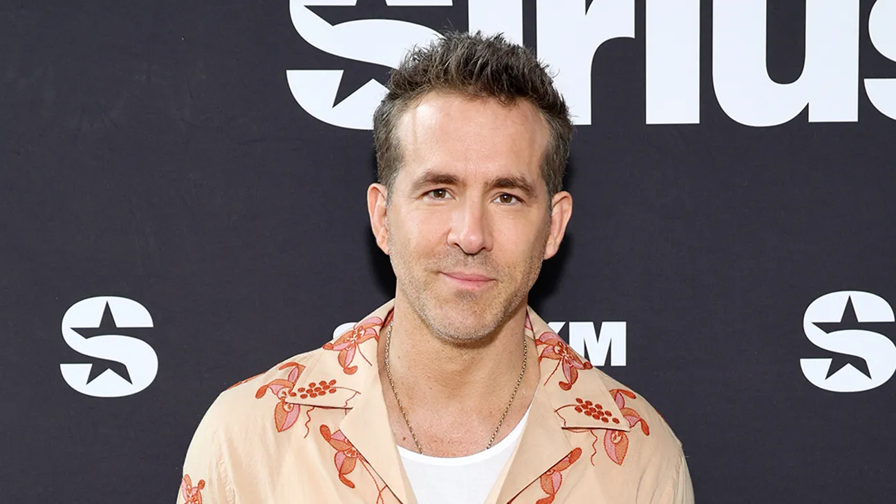 Ryan Reynolds n a floral print shirt at a SiriusXM event.