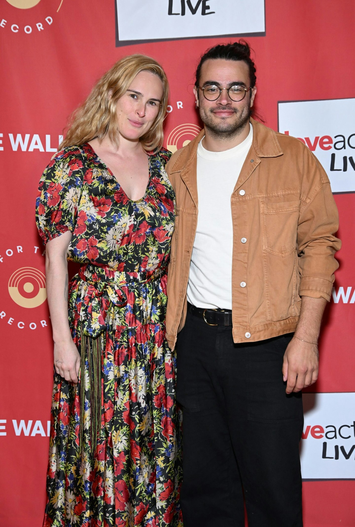 Rumer Willis and Derek Richard Thomas pose together at a red carpet event with