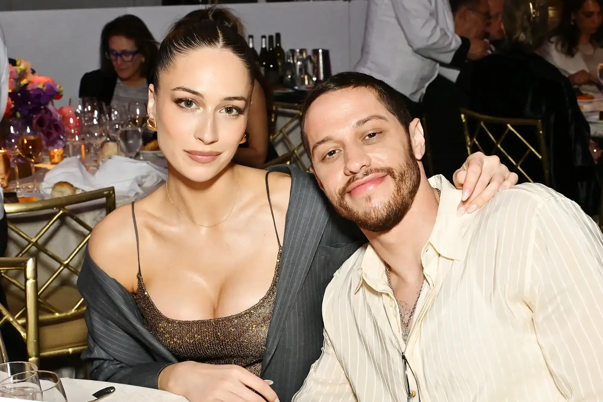 Elsie Hewitt and Pete Davidson seated together at a dinner event.