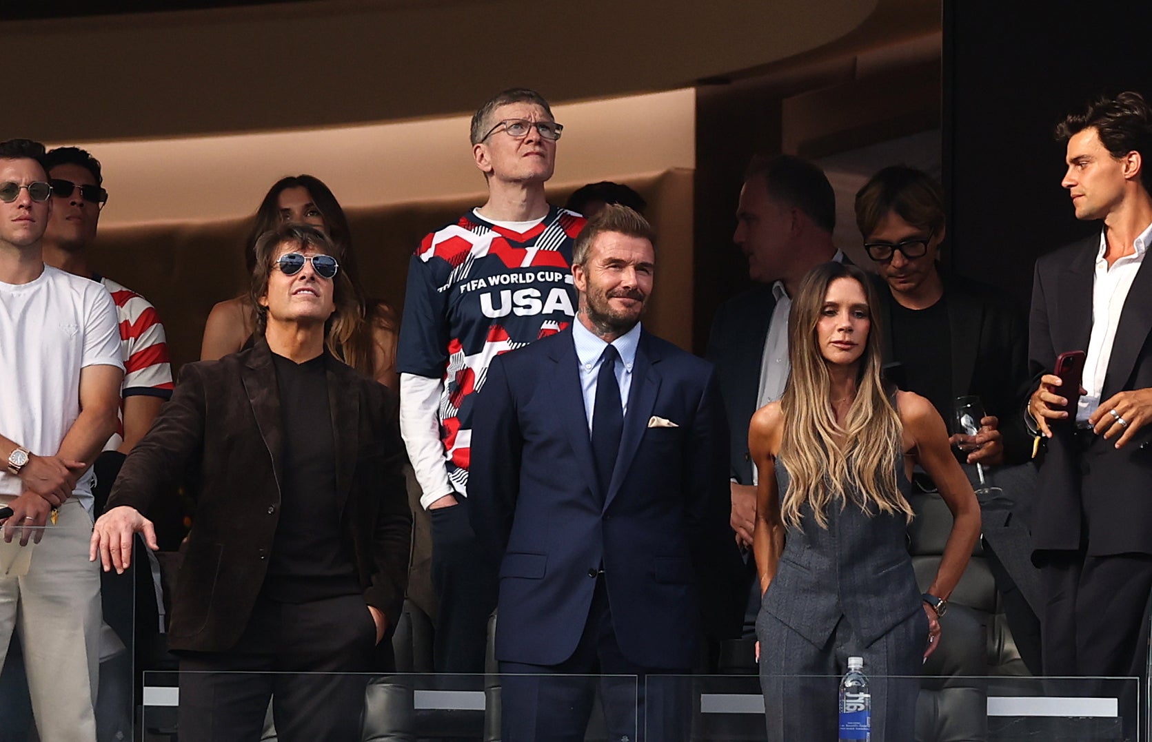 Tom Cruise, David Beckham and Victoria Beckham in a VIP box at the FIFA World Cup.