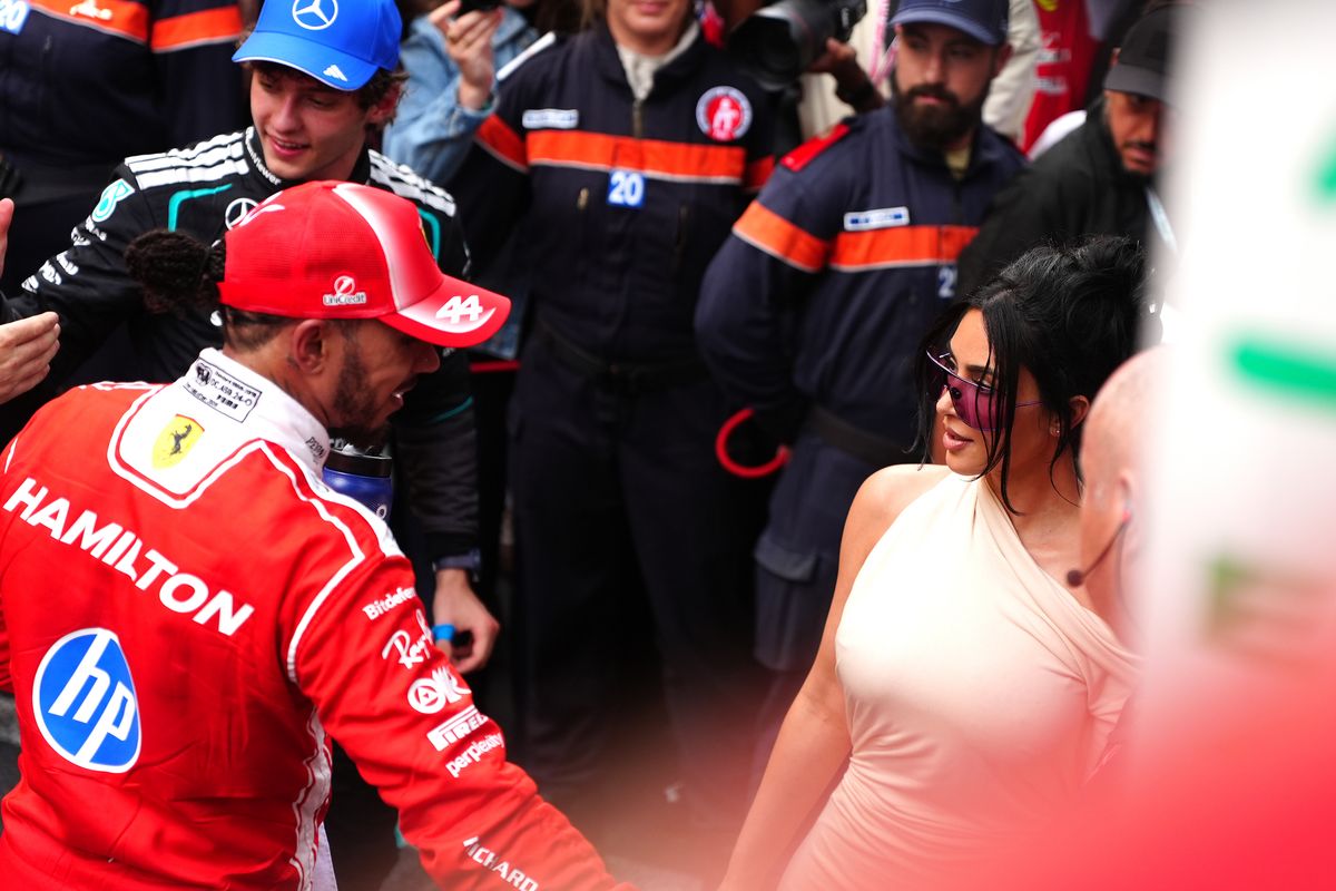 Lewis Hamilton in red Ferrari suit with