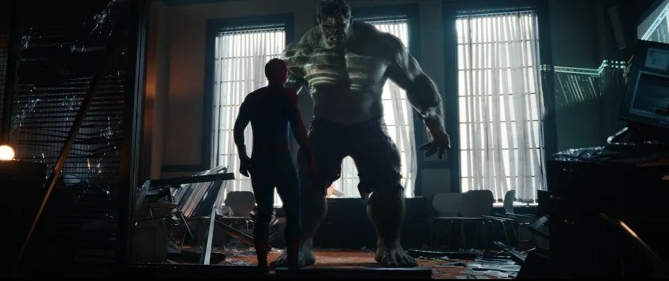Spider-Man and the Hulk facing off in a destroyed room in a film still from the Spider-Man: Brand New Day trailer.