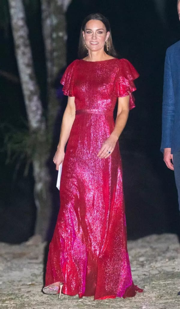 At the Cahal Pech Mayan ruins in Belize in 2022, during the Caribbean royal tour, she dazzled in a floor-length magenta lamé gown by The Vampire's Wife, its flutter sleeves catching the evening light. | Photo: Getty Images