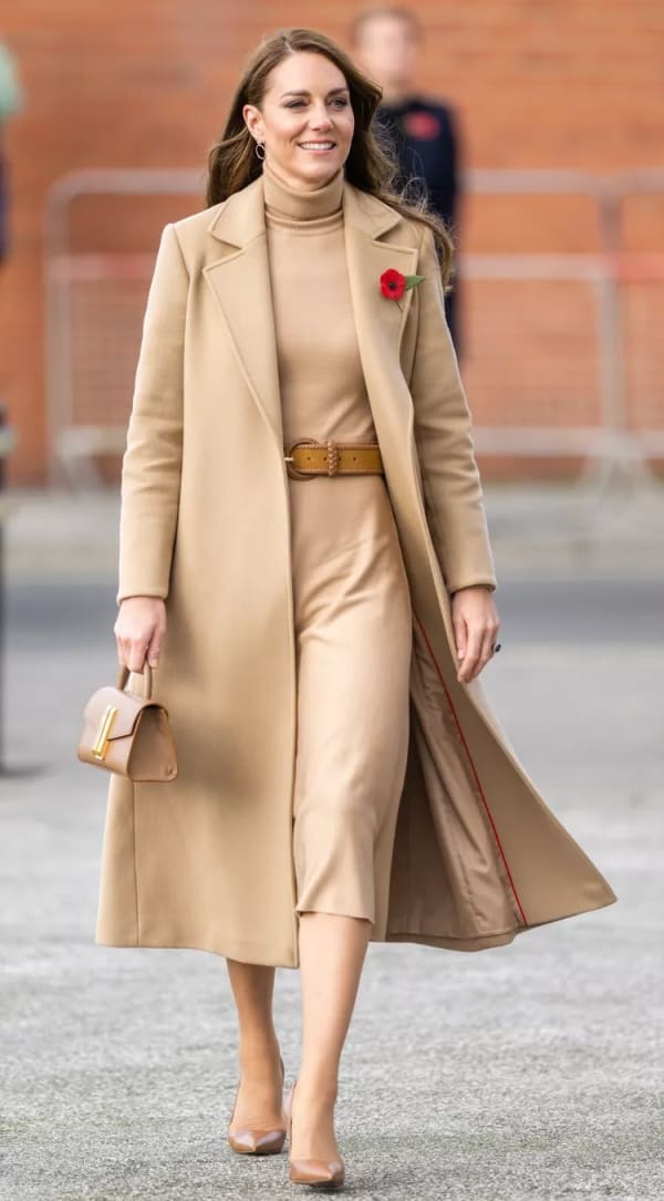 A November 2022 youth mental health engagement in Scarborough called for something quieter — and she delivered in head-to-toe camel, pairing a Max&Co coat over a Gabriela Hearst turtleneck dress. | Photo: Getty Images
