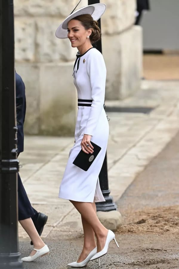 Trooping the Colour in June 2024 marked her first public appearance of the year — and she wore an upcycled Jenny Packham white dress, its neckline refreshed with black ribbon trim and a new bold belt. | Photo: Getty Images