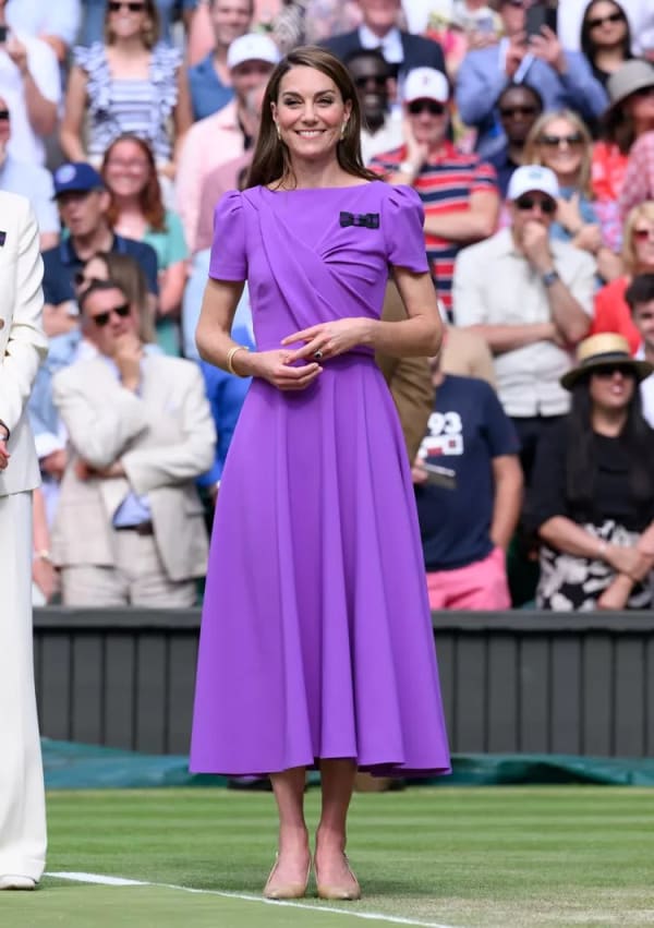The Wimbledon men's final in July 2024 — her second public outing of the year — saw her in a royal purple midi dress by Safiyaa, the puff sleeves and ruched bodice a regal nod to the club's colours. | Photo: Getty Images